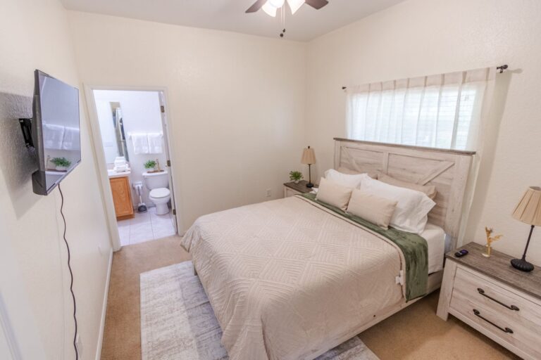 After: Michaels House guest bedroom with wall-mounted TV