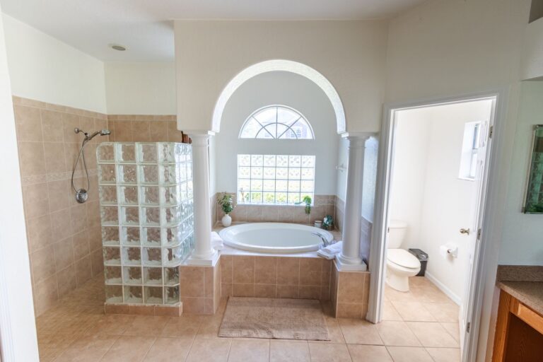 After: Michaels House primary bathroom with soaking tub and glass-block shower