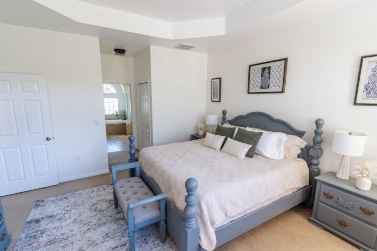 After: Michaels House primary suite with king bed and bench