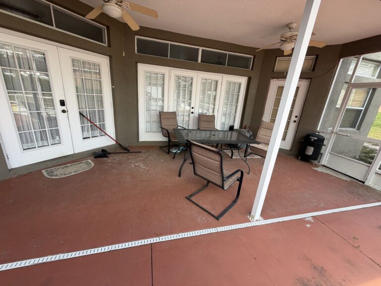 Before: Michaels House covered lanai with old patio furniture
